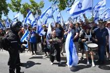Israelis protesters hold Israeli flags and chant for democracy at a demonstration against Prime Minister Benjamin Netanyahu s judicial overhaul, outside the Supreme Court in Jerusalem, on Tuesday, July 11, 2023.