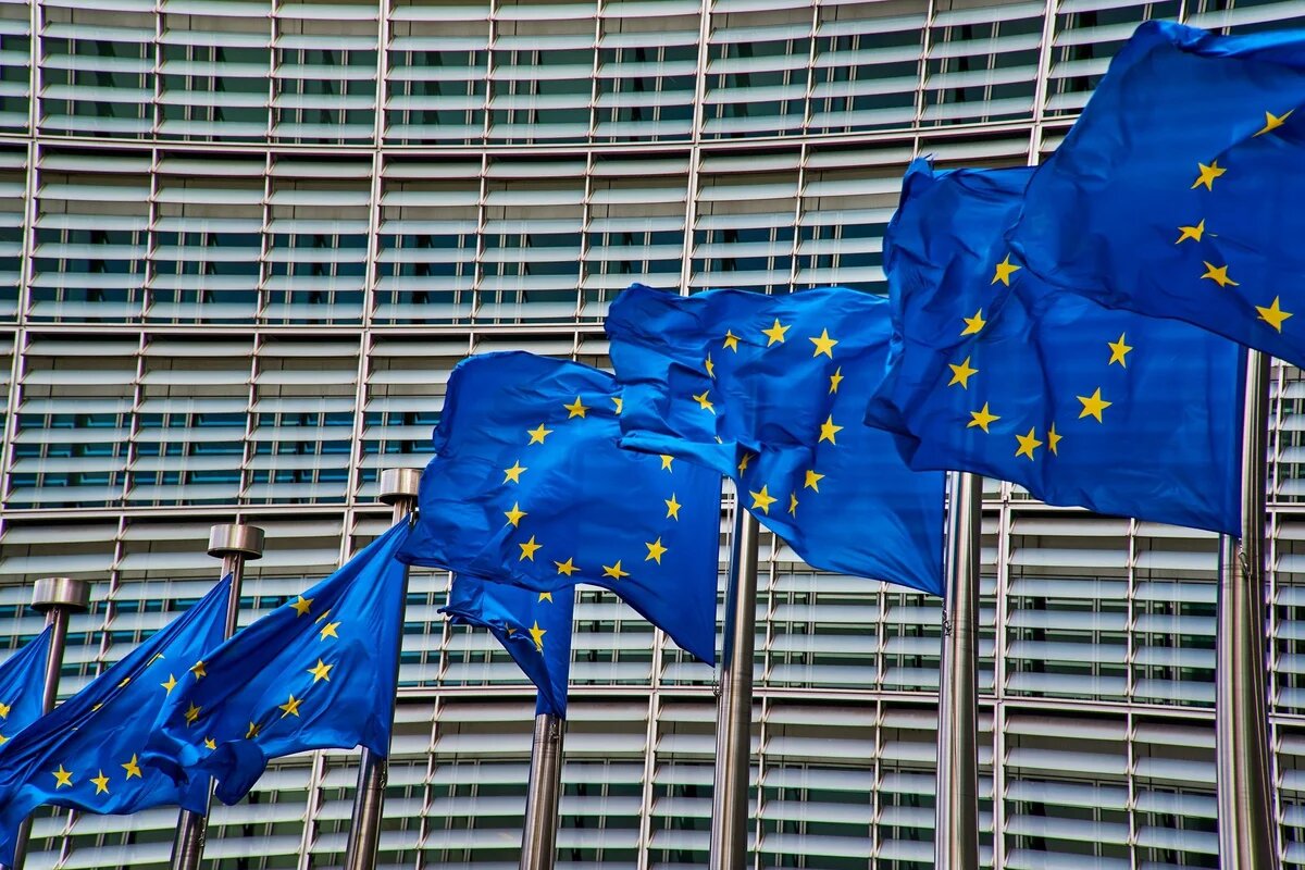 EU flags in front of the European Commission building, Brussels