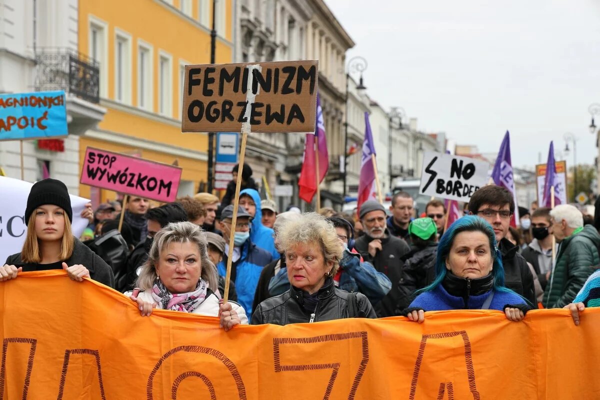 Stop torture on the border - The photo presents a solidarity march "Stop torture on the border" organized by feminist, queer and pro-refugees' activists in Warsaw, in October 2021. The protestants demanded an immediate end to illegal push-backs authorized by the government against the refugess on the Polish- Belarusian border.