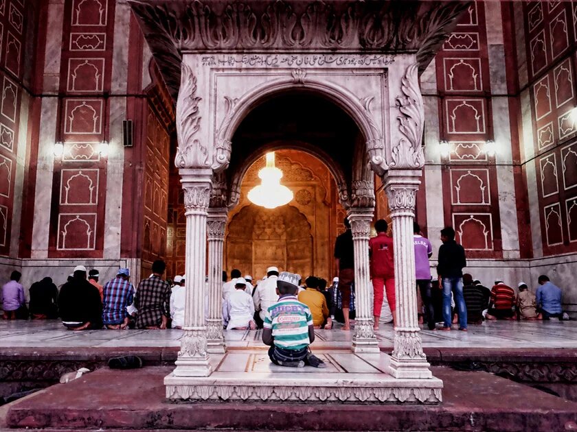 The little boy cheekily grabbed the best spot at Jama Masjid, India's largest mosque.